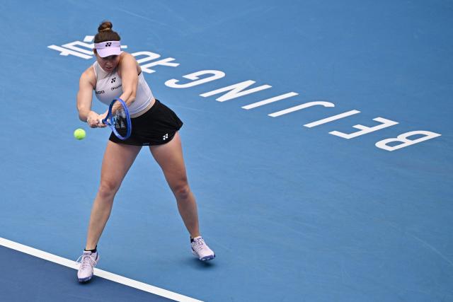 Czech Republic’s Linda Noskova hits a return to Switzerland's Viktorija Golubic during their women's singles match at the China Open tennis tournament in Beijing on October 4, 2026. (Photo by Pedro PARDO / AFP)