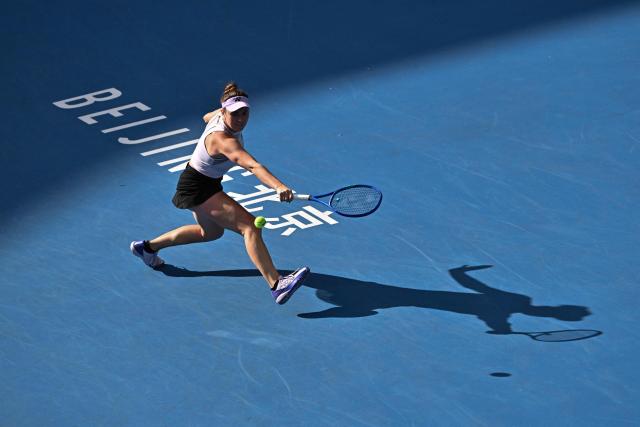 Czech Republic’s Linda Noskova hits a return to Switzerland's Viktorija Golubic during their women's singles match at the China Open tennis tournament in Beijing on October 4, 2026. (Photo by Pedro PARDO / AFP)