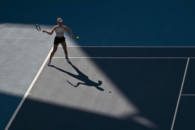 Czech Republic’s Linda Noskova hits a return to Switzerland's Viktorija Golubic during their women's singles match at the China Open tennis tournament in Beijing on October 4, 2026. (Photo by Pedro PARDO / AFP)