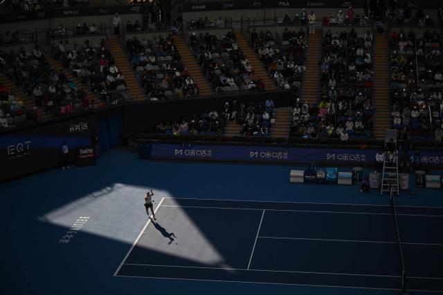 Switzerland's Viktorija Golubic hits a return to Czech Republic’s Linda Noskova during their women's singles match at the China Open tennis tournament in Beijing on October 4, 2026. (Photo by Pedro PARDO / AFP)