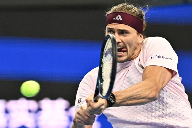 Germany’s Alexander Zverev hits a return to Serbia's Novak Djokovic during their men’s singles quarter-final at the China Open tennis tournament in Beijing on October 4, 2026. (Photo by Pedro PARDO / AFP)