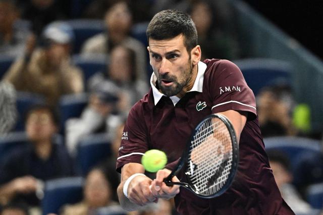 Serbia's Novak Djokovic hits a return to Germany’s Alexander Zverev during their men’s singles quarter-final at the China Open tennis tournament in Beijing on October 4, 2026. (Photo by Pedro PARDO / AFP)