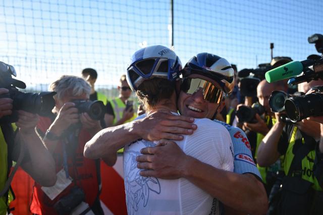 Belgium's rider Remco Evenepoel (R) celebrates with Slovenia's rider Jan Tratnik after winning the men's elite road race of the UEC European Road Cycling Championships in Sencur, near Ljubljana, Slovenia, on October 4, 2026. (Photo by JURE MAKOVEC / AFP)