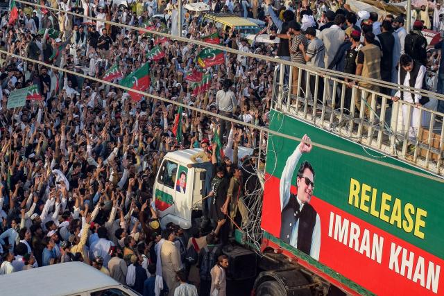 Supporters of jailed former prime minister Imran Khan's Pakistan Tehreek-e-Insaf (PTI) party take part in a long march in Lakki Marwat of Pakistan's Khyber Pakhtunkhwa province on October 4, 2026. A march protesting against the imprisonment of former Pakistani prime minister Imran Khan kicked off in northwest Pakistan on October 4 after talks to avoid the demonstration stalled. (Photo by Marwat AKBAR / AFP)