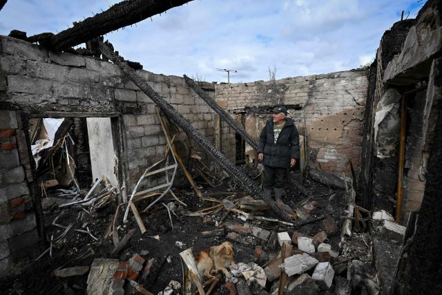 Local resident Nikolay looks around his house which was destroyed on October 3, 2026 during which local Russian-installed officials called an overnight Ukrainian drone attack, in Donetsk, Russian-controlled Ukraine, on October 4, 2026, amid the ongoing Russian-Ukrainian conflict. (Photo by AFP)