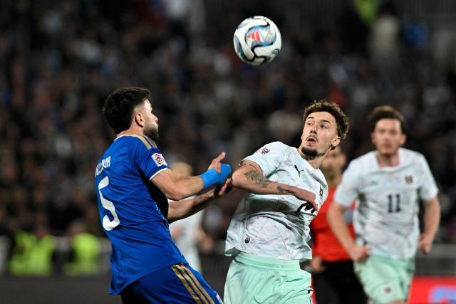 Austria's midfielder #07 Vasilije Markovic and Kosovo's defender #05 Lumbardh Dellova fight for the ball during the UEFA Nations League football match between Kosovo and Austria in Pristina on October 4, 2026. (Photo by Armend NIMANI / AFP)