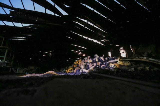 This photo shows a general view of melted foam inside a factory after a strike that Houthi authorities-run media attributed to Saudi Arabia, in the Shamlan neighbourhood of Yemen's capital Sanaa on October 4, 2026. Yemen relapsed into war in July after years of calm, drawn into the regional conflict triggered by the US-Israeli offensive against Iran that began at the end of February. (Photo by Mohammed HUWAIS / AFP) / 