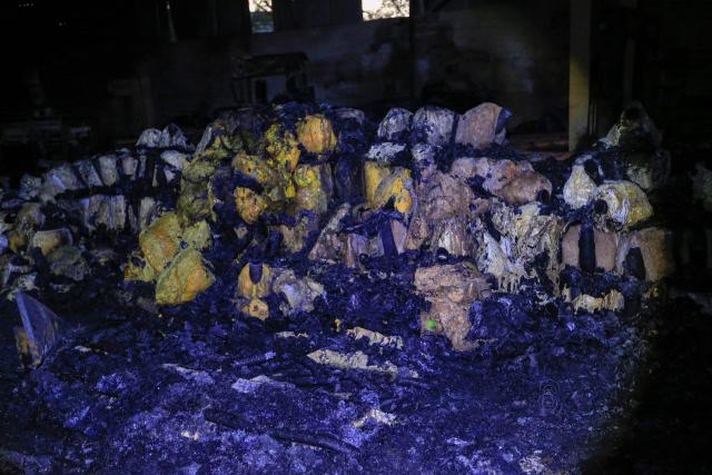 This photo shows a general view of melted foam inside a factory after a strike that Houthi authorities-run media attributed to Saudi Arabia, in the Shamlan neighbourhood of Yemen's capital Sanaa on October 4, 2026. Yemen relapsed into war in July after years of calm, drawn into the regional conflict triggered by the US-Israeli offensive against Iran that began at the end of February. (Photo by Mohammed HUWAIS / AFP) / 