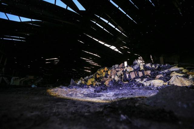 This photo shows a general view of melted foam inside a factory after a strike that Houthi authorities-run media attributed to Saudi Arabia, in the Shamlan neighbourhood of Yemen's capital Sanaa on October 4, 2026. Yemen relapsed into war in July after years of calm, drawn into the regional conflict triggered by the US-Israeli offensive against Iran that began at the end of February. (Photo by Mohammed HUWAIS / AFP) / 