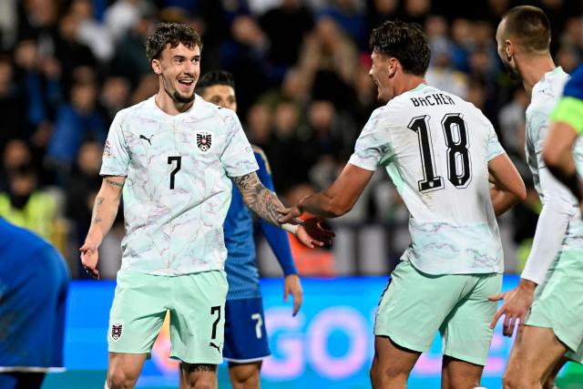 Austria's midfielder #07 Christoph Lang celebrates with teammates after scoring his team's first goal during the UEFA Nations League football match between Kosovo and Austria in Pristina on October 4, 2026. (Photo by Armend NIMANI / AFP)
