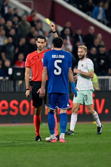 Kosovo's defender #05 Lumbardh Dellova receives a yellow card during the UEFA Nations League football match between Kosovo and Austria in Pristina on October 4, 2026. (Photo by Armend NIMANI / AFP)