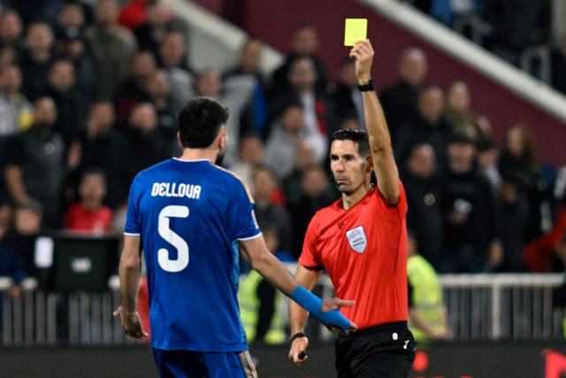 Kosovo's defender #05 Lumbardh Dellova receives a yellow card during the UEFA Nations League football match between Kosovo and Austria in Pristina on October 4, 2026. (Photo by Armend NIMANI / AFP)