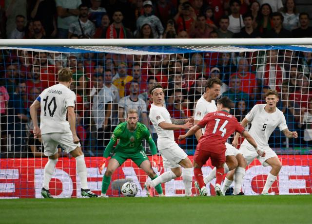 Portugal's forward #14 Francisco Conceicao challenges Norway's goalkeeper #13 Egil Selvik during the UEFA Nations League Group 4 football match between Portugal and Norway at Dragao stadium in Porto on October 3, 2026. (Photo by Miguel RIOPA / AFP)