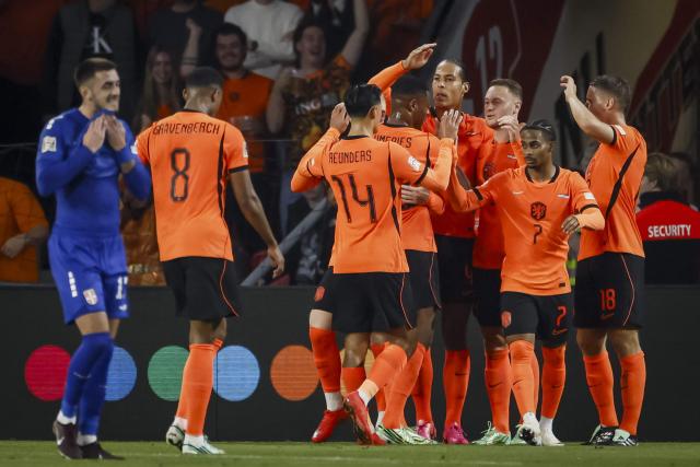 Netherlands' midfielder #20 Teun Koopmeiners (unseen) celebrates scoring his team's first goal with teammates during the UEFA Nations League football Group A2 match between the Netherlands and Serbia at the Philips stadium in Eindhoven on October 4, 2026. (Photo by Koen van Weel / ANP / AFP) / Netherlands OUT