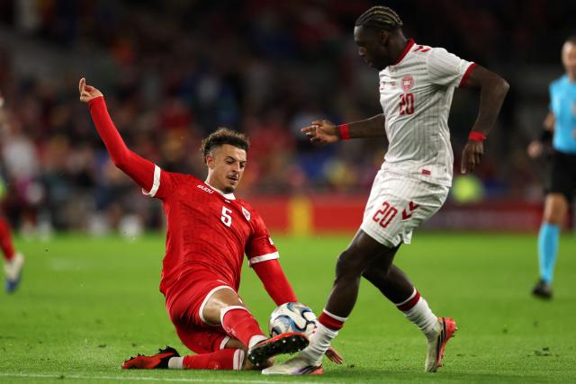 Wales' midfielder #05 Ethan Ampadu (L) vies for the ball with Denmark's midfielder #20 Mohamed Daramy (R) during the UEFA Nations League, league A, group 4 football match between Wales and Denmark, at the Cardiff City Stadium in Cardiff, south Wales, on October 4, 2026. (Photo by Adrian DENNIS / AFP)