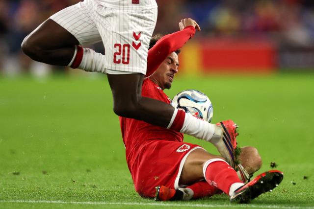 Denmark's midfielder #20 Mohamed Daramy (L) vies for the ball with Wales' midfielder #05 Ethan Ampadu (R) during the UEFA Nations League, league A, group 4 football match between Wales and Denmark, at the Cardiff City Stadium in Cardiff, south Wales, on October 4, 2026. (Photo by Adrian DENNIS / AFP)
