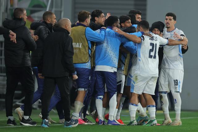 Israel's players celebrate after scoring their first goal during the UEFA Nations League Group B3 football match between the Republic of Ireland and Israel at the TSC Arena in Backa Topola on October 4, 2026. (Photo by Pedja Milosavljevic / AFP)