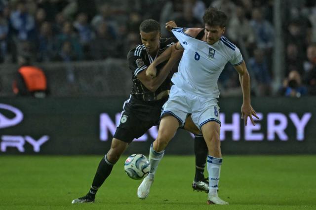 Germany's defender #02 Malick Thiaw (L) fights for the ball with Greece's forward #08 Fotis Ioannidis (R) during the UEFA Nations League League A Group 2 matchday 4 match between Greece and Germany at Toumba Stadium in Thessaloniki on October 4, 2026. (Photo by Aris MESSINIS / AFP)