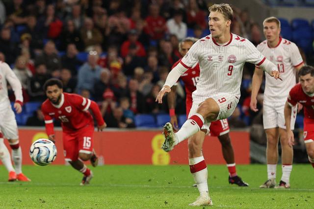 Denmark's striker #09 Rasmus Hojlund scores the team's first goal from the penalty spot during the UEFA Nations League, league A, group 4 football match between Wales and Denmark, at the Cardiff City Stadium in Cardiff, south Wales, on October 4, 2026. (Photo by Adrian Dennis / AFP)
