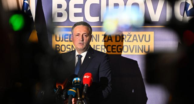 Bosnian Muslim left-wing politician Denis Becirovic addresses the media after winning a mandate as the Bosnian Muslim member of Bosnia's tripartite presidency in Sarajevo on October 4, 2026. The former president of Bosnia's Serb statelet, Milorad Dodik, said his party had retained power in the entity and its seat on the shared presidency, as preliminary results showed a drop in turnout for Bosnia's general elections. (Photo by ELVIS BARUKCIC / AFP)
