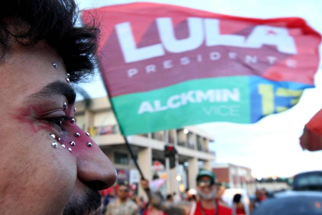 Supporters of Brazil's President and Presidential candidate Luiz Inacio Lula da Silva gather after the partial results of the presidential election in Brasilia on October 4, 2026. Brazilian senator Flavio Bolsonaro, son of the far-right former president Jair Bolsonaro, is leading incumbent Luiz Inacio Lula da Silva in partial results from October 4, 2026, election. (Photo by Igo Estrela / AFP)