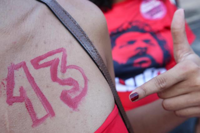 A supporters of Brazil's President and Presidential candidate Luiz Inacio Lula da Silva gestures following the partial results of the presidential election in Brasilia on October 4, 2026. Brazilian senator Flavio Bolsonaro, son of the far-right former president Jair Bolsonaro, is leading incumbent Luiz Inacio Lula da Silva in partial results from October 4, 2026, election. (Photo by Igo Estrela / AFP)