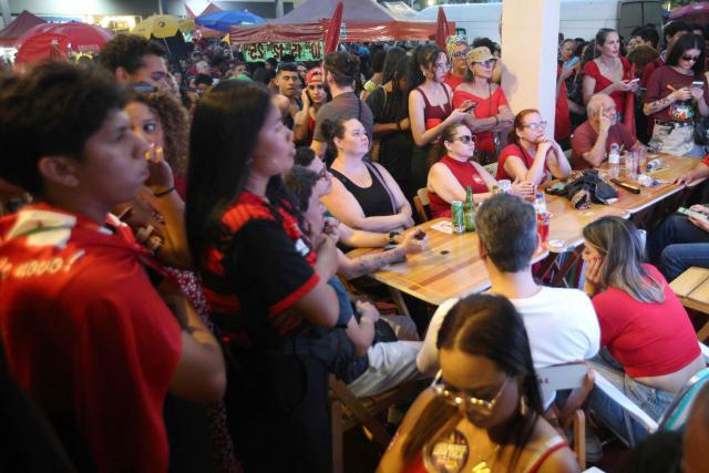Supporters of Brazil's President and Presidential candidate Luiz Inacio Lula da Silva react following the partial results of the presidential election in Brasilia on October 4, 2026. Brazilian senator Flavio Bolsonaro, son of the far-right former president Jair Bolsonaro, is leading incumbent Luiz Inacio Lula da Silva in partial results from October 4, 2026, election. (Photo by Igo Estrela / AFP)