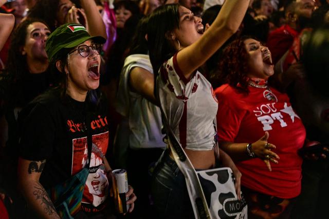Supporters of Brazil's President and Presidential candidate Luiz Inacio Lula da Silva react following the partial results of the presidential election in Sao Paulo, Brazil on October 4, 2026. Brazilian senator Flavio Bolsonaro, son of the far-right former president Jair Bolsonaro, is leading incumbent Luiz Inacio Lula da Silva in partial results from October 4, 2026, election. (Photo by Pablo PORCIUNCULA / AFP)