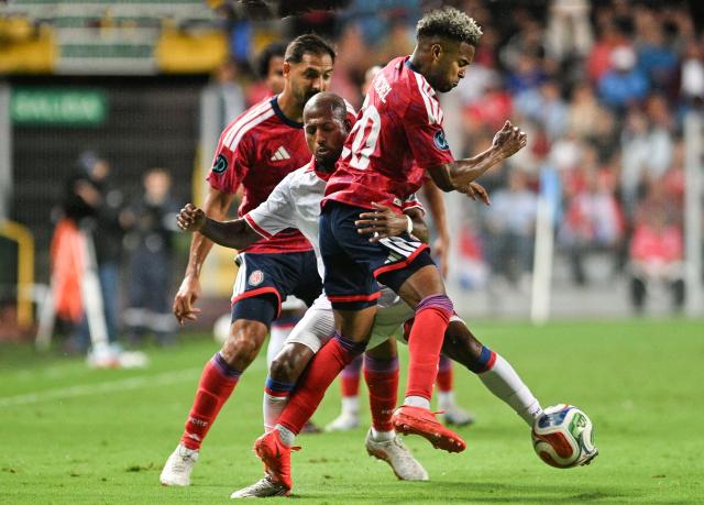 Haiti's forward #07 Fafa Picault (C) and Costa Rica's defender #20 Kenyel Michel (R) fight for the ball past Costa Rica's midfielder #05 Celso Borges (L) during the Concacaf Nations League Cup football match between Costa Rica and Haiti at the Ricardo Saprissa Ayma Stadium in San Jose on October 4, 2026. (Photo by Ezequiel BECERRA / AFP)