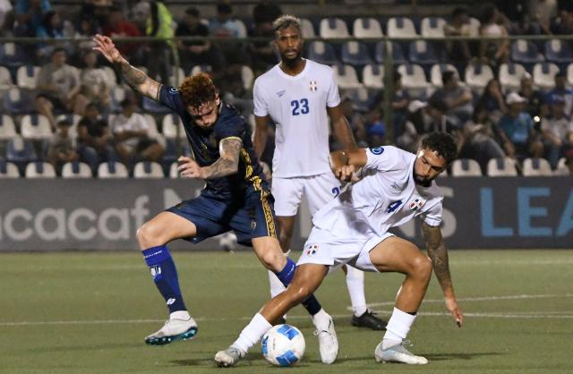 Nicaragua's forward #09 Jaime Moreno and Dominican Republic's defender #04 Edgar Pujol fight for the ball as Dominican Republic's defender #23 Luiyi de Lucas looks on during the Concacaf Nations League Cup football match between Nicaragua and Dominican Republic at the National Stadium in Managua on October 4, 2026. (Photo by AFP)