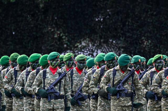 Army personnel stand in formation during the 81st anniversary of the Indonesian National Armed Forces (TNI) in Banda Aceh on October 5, 2026. (Photo by CHAIDEER MAHYUDDIN / AFP)