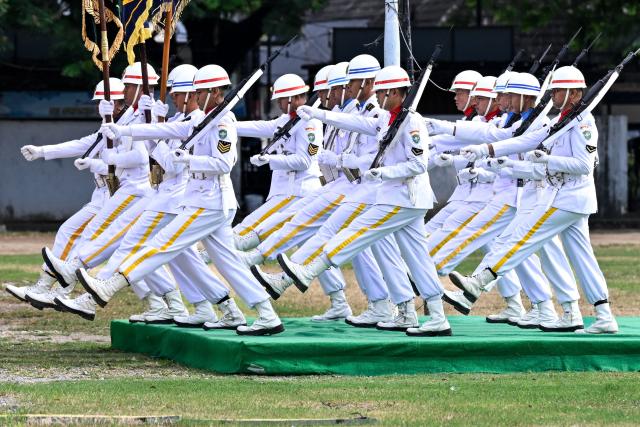 Army personnel march during the 81st anniversary of the Indonesian National Armed Forces (TNI) in Banda Aceh on October 5, 2026. (Photo by CHAIDEER MAHYUDDIN / AFP)