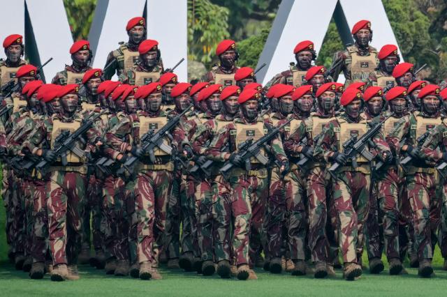Soldiers from Kopassus, Indonesia's elite Army special forces unit march during the 81st TNI Anniversary Day Parade in Cilangkap, East Jakarta, on October 5, 2026. (Photo by BAY ISMOYO / AFP)
