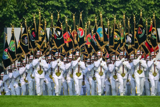 Soldiers march during the 81st Indonesian National Armed Forces Day Parade in Cilangkap, East Jakarta, on October 5, 2026. (Photo by BAY ISMOYO / AFP)