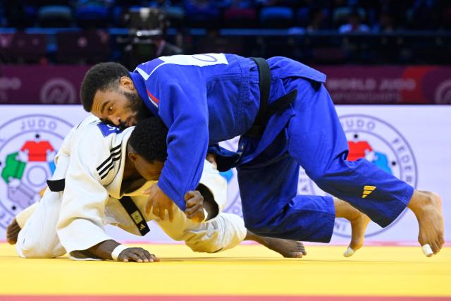 Ecuador's Jonathan Benavides (white) competes against France's Daikii Bouba in the men's under 66 kg round of 64 at the World Judo Championships in Baku on October 5, 2026. (Photo by Alexander NEMENOV / AFP)