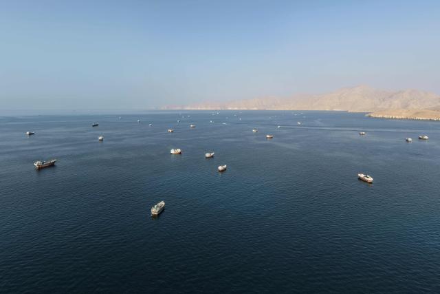 (FILES) An aerial view shows ships anchored off the coast of Khasab in Omans Musandam Governorate, near the Strait of Hormuz, on October 2, 2026. Middle East oil exports, excluding Iran, surpassed their pre-war levels last week, despite attacks on ships in the Strait of Hormuz, according to data from the maritime tracking firm Kpler on October 5, 2026. For the first time since the US and Israel launched their offensive against Iran at the end of February, the weekly average of shipments rose for several days above the pre-conflict average of 18 million barrels per day. (Photo by AFP)