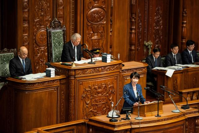 Japan's Prime Minister Sanae Takaichi (3rd L) delivers a speech during a plenary session of the House of Representatives at the National Diet in Tokyo on October 5, 2026. (Photo by Yuichi YAMAZAKI / AFP)