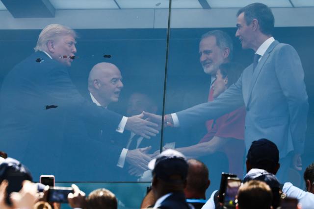 (FILES) US President Donald Trump (L) shakes hands with Spain's Prime Minister Pedro Sanchez next to FIFA President Gianni Infantino (2nd-L), Spain's King Felipe VI (C), and Spain's Queen Letizia (2nd-R) ahead of the 2026 World Cup football tournament final match between Spain and Argentina at the New York/New Jersey Stadium in East Rutherford on July 19, 2026. Spanish Prime Minister Pedro Sanchez called early election for November 29 after housing set-back during a televised speech on October 5, 2026. (Photo by FRANCK FIFE / AFP)
