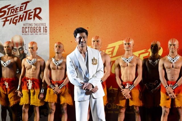 Indian actor Vidyut Jammwal (C) poses during the promotion of his upcoming Hollywood debut action-comedy film 'Street Fighter' in Mumbai on October 5, 2026. (Photo by Sujit JAISWAL / AFP)