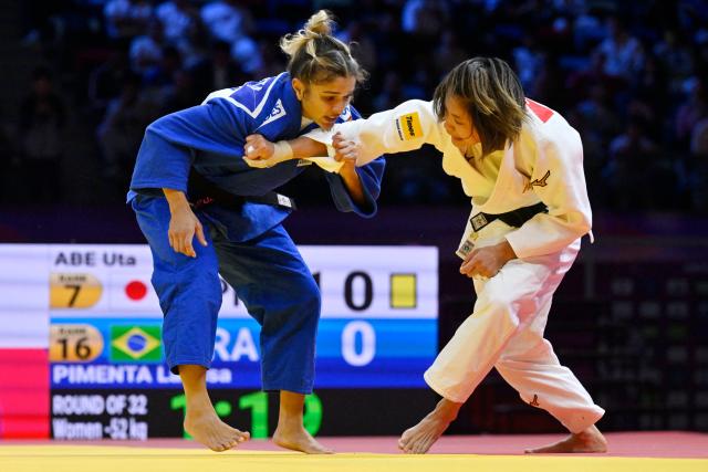 Japan's Uta Abe (white) competes against Brazil's Larissa Pimenta in the women's under 52 kg round of 32 at the World Judo Championships in Baku on October 5, 2026. (Photo by Alexander NEMENOV / AFP)