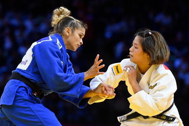 Japan's Uta Abe (white) competes against Brazil's Larissa Pimenta in the women's under 52 kg round of 32 at the World Judo Championships in Baku on October 5, 2026. (Photo by Alexander NEMENOV / AFP)