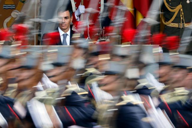 (FILES) Spain's Prime Minister Pedro Sanchez watches the Spain's National Day military parade in Madrid, on October 12, 2025. Spanish Prime Minister Pedro Sanchez called early election for November 29 after housing set-back during a televised speech on October 5, 2026. (Photo by Oscar DEL POZO / AFP)