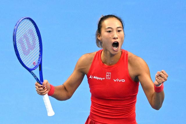 China’s Zheng Qinwen reacts after defeating Czech Republic’s Marie Bouzkova in their women’s singles match at the China Open tennis tournament in Beijing on October 5, 2026. (Photo by Greg Baker / AFP)