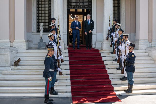 Greek Prime Minister Kyriakos Mitsotakis (L) welcomes Lithuanian President Gitanas Nauseda, before their meeting at the Maximos Mansion, in Athens, on October 5, 2026. (Photo by Angelos TZORTZINIS / AFP)