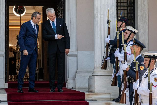 Greek Prime Minister Kyriakos Mitsotakis (L) and Lithuanian President Gitanas Nauseda react before their meeting at the Maximos Mansion, in Athens, on October 5, 2026. (Photo by Angelos TZORTZINIS / AFP)