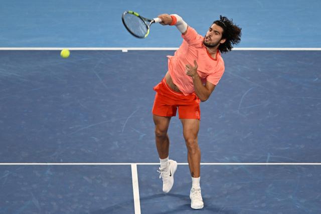 Spain's Carlos Alcaraz hits a return against compatriot Jaume Munar during their men's singles semi-final tennis match at the ATP Tour Japan Open Tennis Championships at the Ariake Tennis Forest Park in Tokyo on October 5, 2026. (Photo by Rie KIKUCHI / AFP)