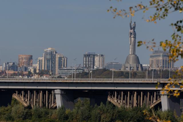 This photograph shows the Darnytsia Bridge and Ukrainian Motherland Monument behind in Kyiv on October 5, 2026, amid the Russian invasion of Ukraine. Moscow has ramped up its pummelling of Kyiv, launching waves of drones at the city, targeting key infrastructure and putting the capital on a near-constant state of alert against attacks. (Photo by Tetiana DZHAFAROVA / AFP)