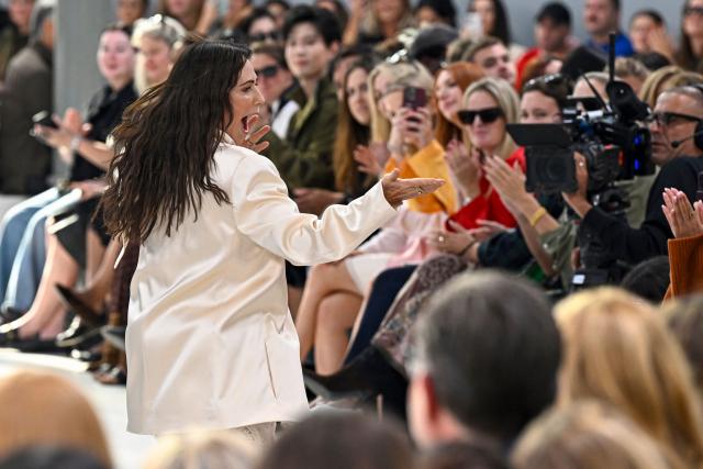 Australian designer Nicky Zimmermann for Zimmermann aknowledges the audience a the end of the Zimmermann Women's Spring/Summer 2027 collection fashion show as part of the Paris Fashion Week, in Paris on October 5, 2026. (Photo by JULIEN DE ROSA / AFP)