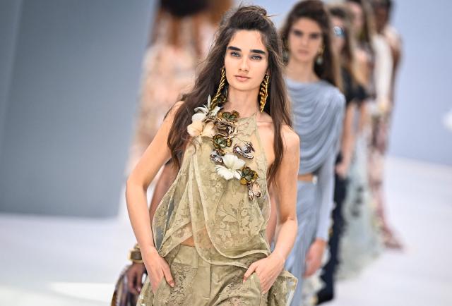 A model presents a creation for Zimmermann Women's Spring/Summer 2027 collection fashion show as part of the Paris Fashion Week, in Paris on October 5, 2026. (Photo by JULIEN DE ROSA / AFP)