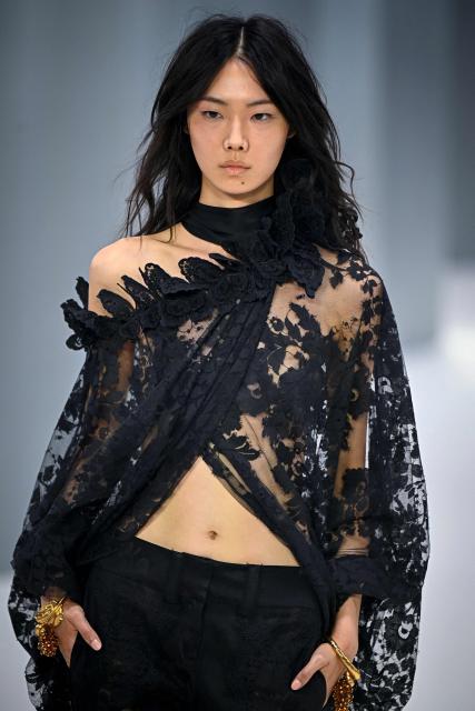 Chinese model Sijia Kang presents a creation for Zimmermann Women's Spring/Summer 2027 collection fashion show as part of the Paris Fashion Week, in Paris on October 5, 2026. (Photo by JULIEN DE ROSA / AFP)